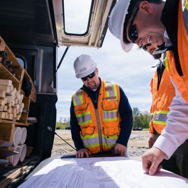 Engineers look over plans at a construction project in North Conway, NH.