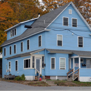A blue house on Katahdin Avenue in Millinocket, Maine