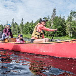 A family in a canoe on a lake