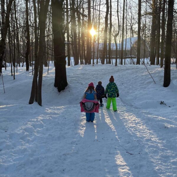 kids play outdoors on the snow