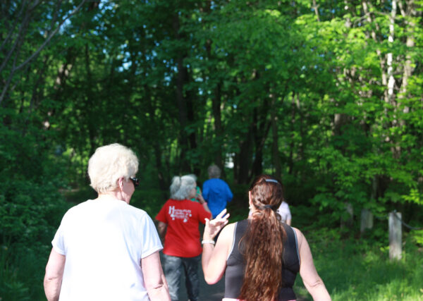 People walk through the woods