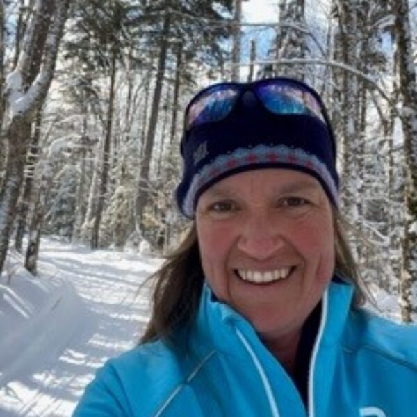 portrait of woman on ski trail