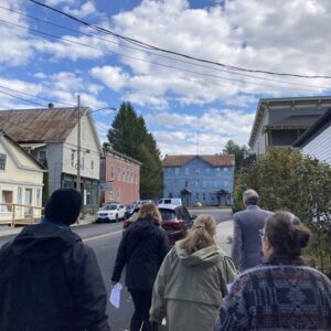 Two men and one woman tour the proposed historic district in the hamlet of Chestertown.