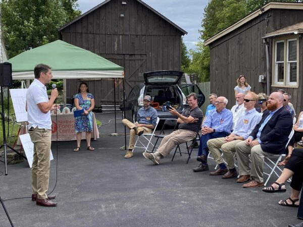 Assemblyman Billy Jones speaks at Tupper Lake housing event.