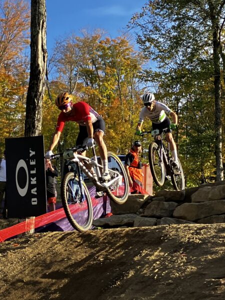 Mountain bikers race downhill during a World Cup competition.