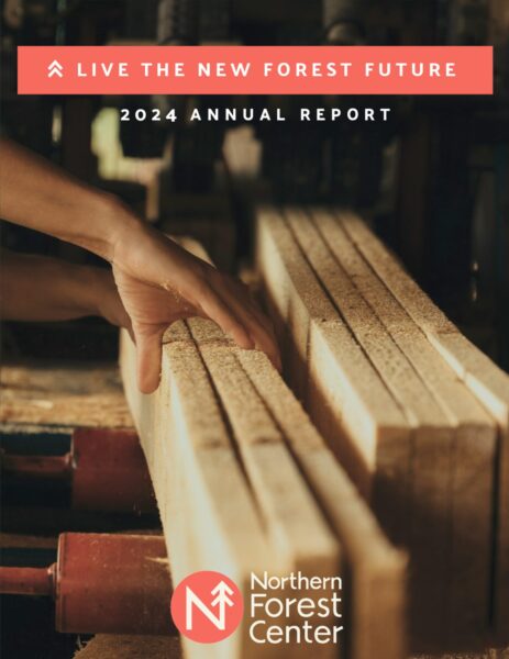 Cover of the 2024 Northern Forest Center annual report showing boards being milled.
