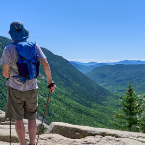 Hikers taking in the view from Mt. Willard in the White Mountain National Forest.