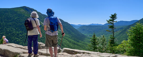 Hikers taking in the view from Mt. Willard in the White Mountain National Forest.