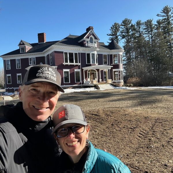 man and woman in front of housing redevelopment project.