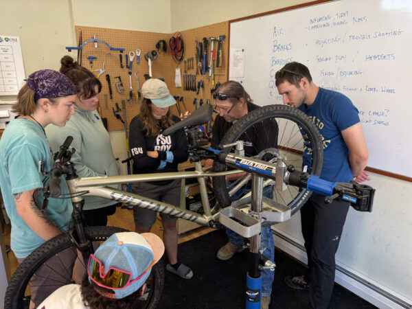 Interns learn about bike maintenance