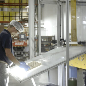 A man works in the Tanbark facility in Maine, creating wood-based packaging to replace plastic.