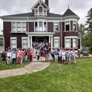 people celebrate the opening of apartments in the Gehring House, renovated by the Northern Forest Center