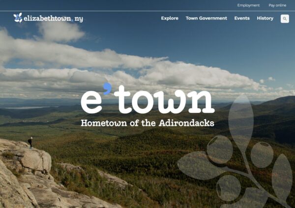 screenshot of new website homepage for Elizabethtown, NY, showing the town's nickname "e'town" on a scenic photo